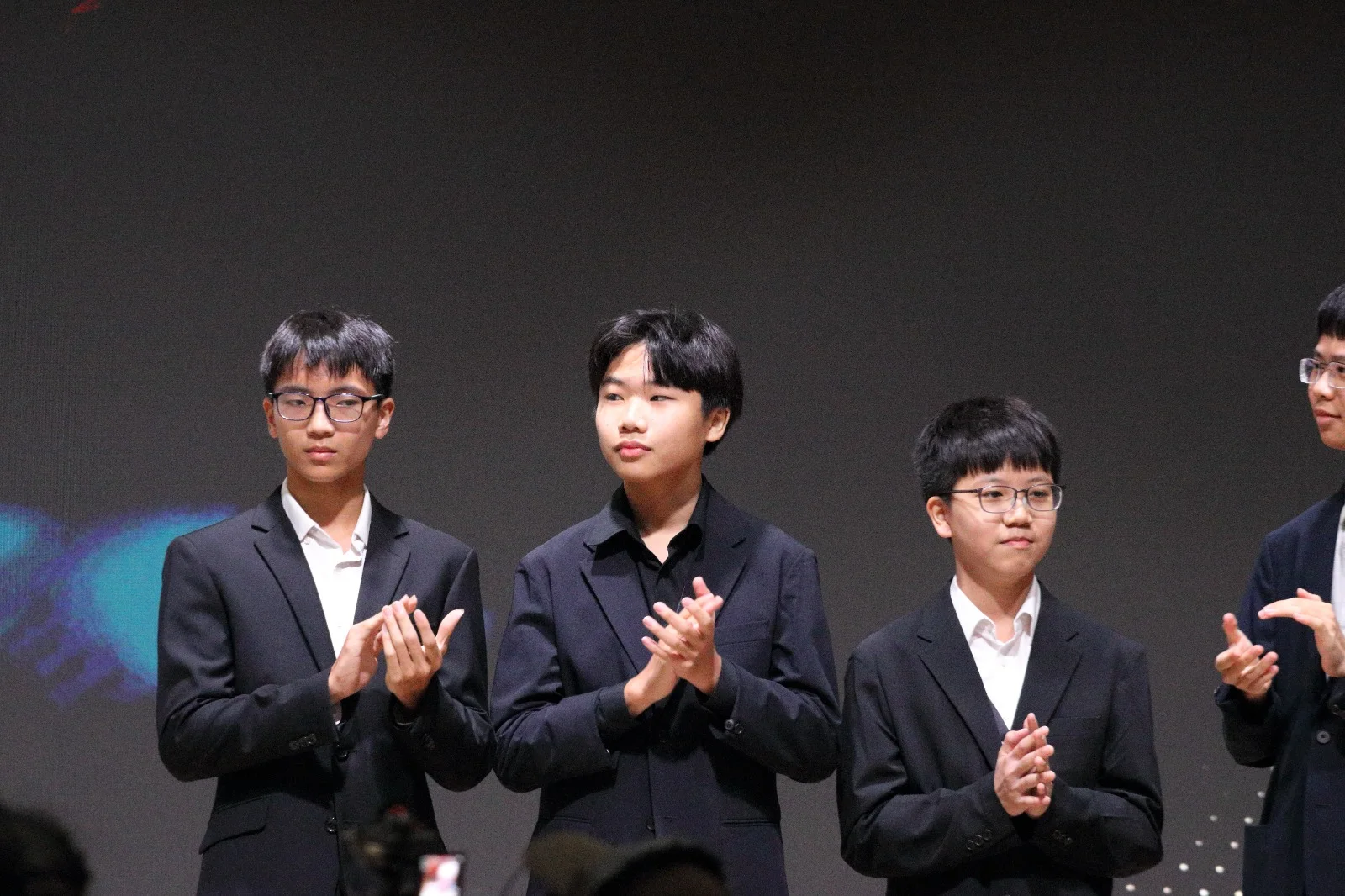 Averius Wan applauding on stage with the team at the DrugFreeSG 2026 ceremony