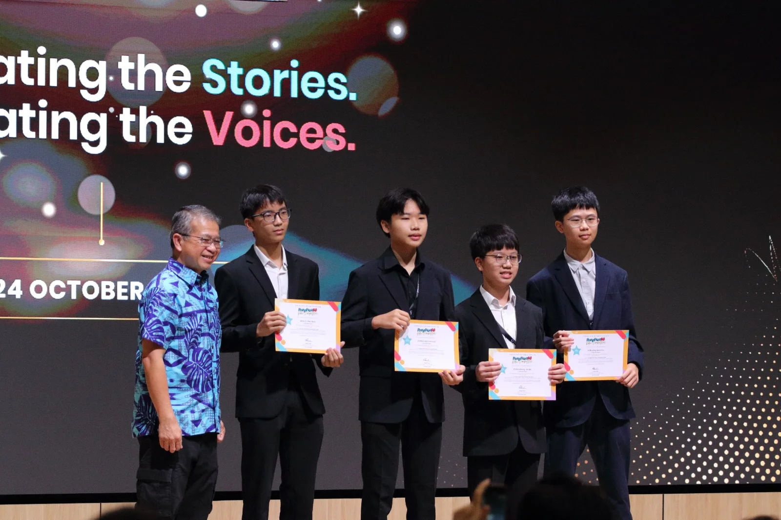 The team holding certificates on stage at DrugFreeSG 2026